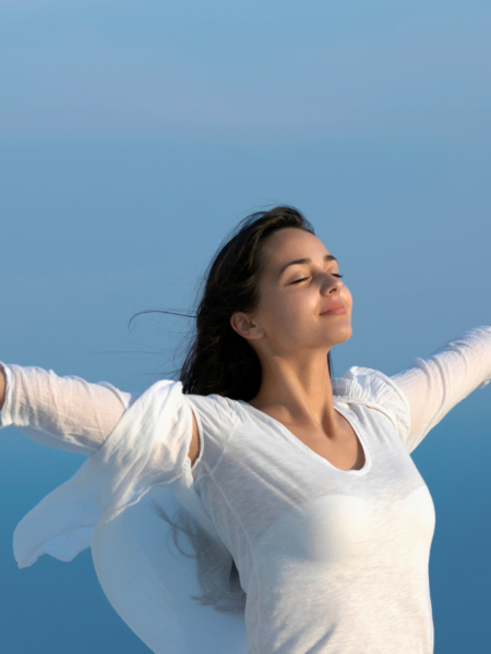 happy young woman enjoy sunset while dancing and enjoy music on headphones