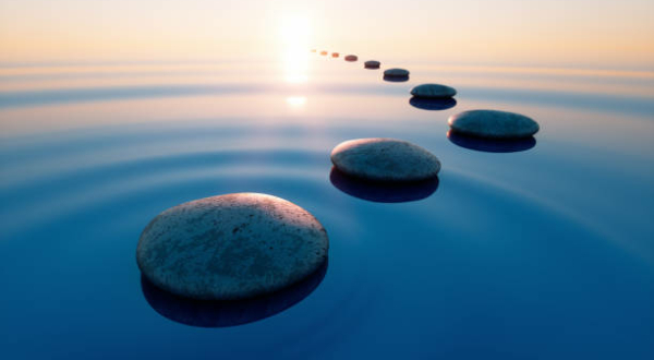 Row of stones in calm water in the wide ocean concept of meditation - 3D illustration